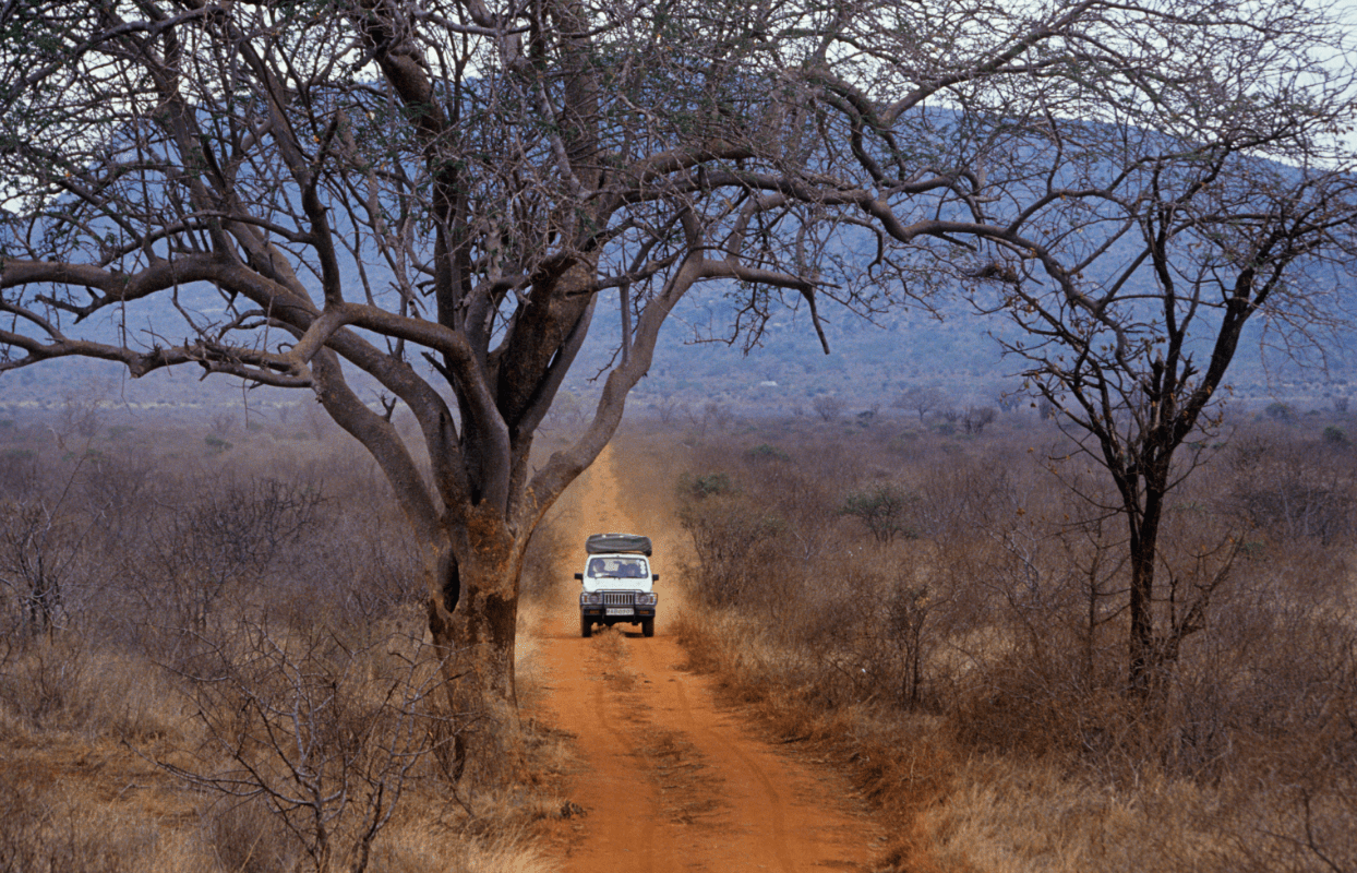 Gallery Slider - Off Road Vehicle on Dirt Road Sustainable Safaris Africa - Destinations - Kenya - Off Road Vehicle on Dirt Road
