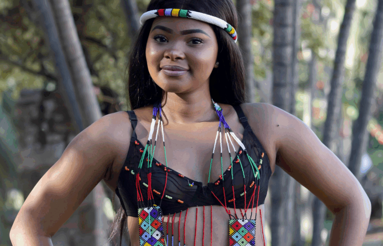 Woman Wearing Beaded Dress Looking at Camera