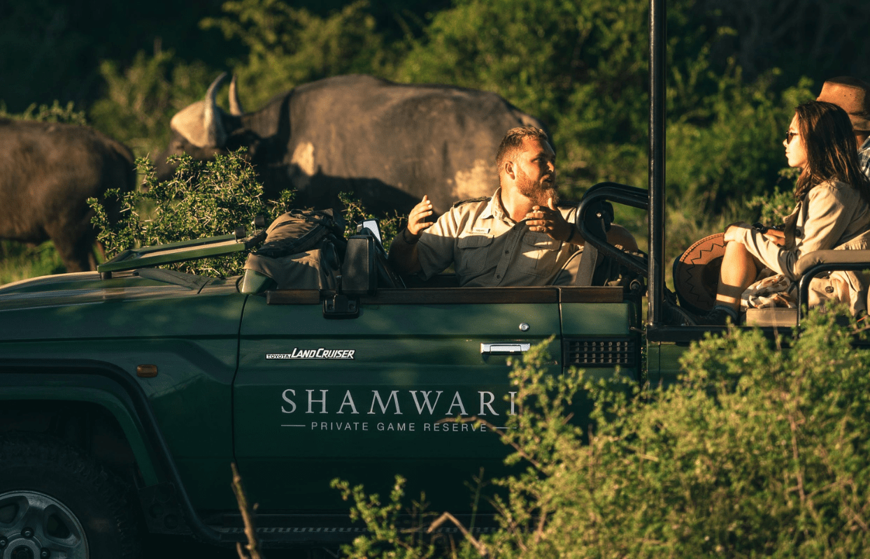S009-IT2 - Shamwari Game Drive Vehicle and Guide on Tourist Safari Game Drive Sustainable Safaris Africa - Journeys - Luxury Eastern Cape Family Safari - Shamwari Game Drive Vehicle and Guide on Tourist Safari Game Drive