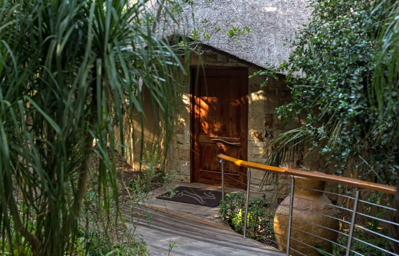 S008 - IT2 - Door Entrance to Accommodation Hidden Away in Greenery Sustainable Safaris Africa - Journeys - Luxury Eastern Cape Couples Safari - Door Entrance to Accommodation Hidden Away in Greenery