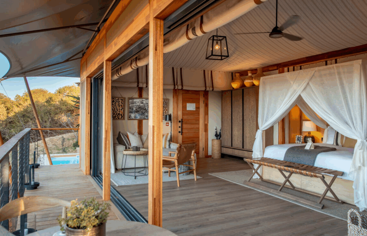 S008 - IT1 - Bedroom Suite and Bed with Mosquito Net at Sindile Lodge Accommodation Sustainable Safaris Africa - Journeys - Luxury Eastern Cape Couples Safari - Bedroom Suite and Bed with Mosquito Net at Sindile Lodge Accommodation