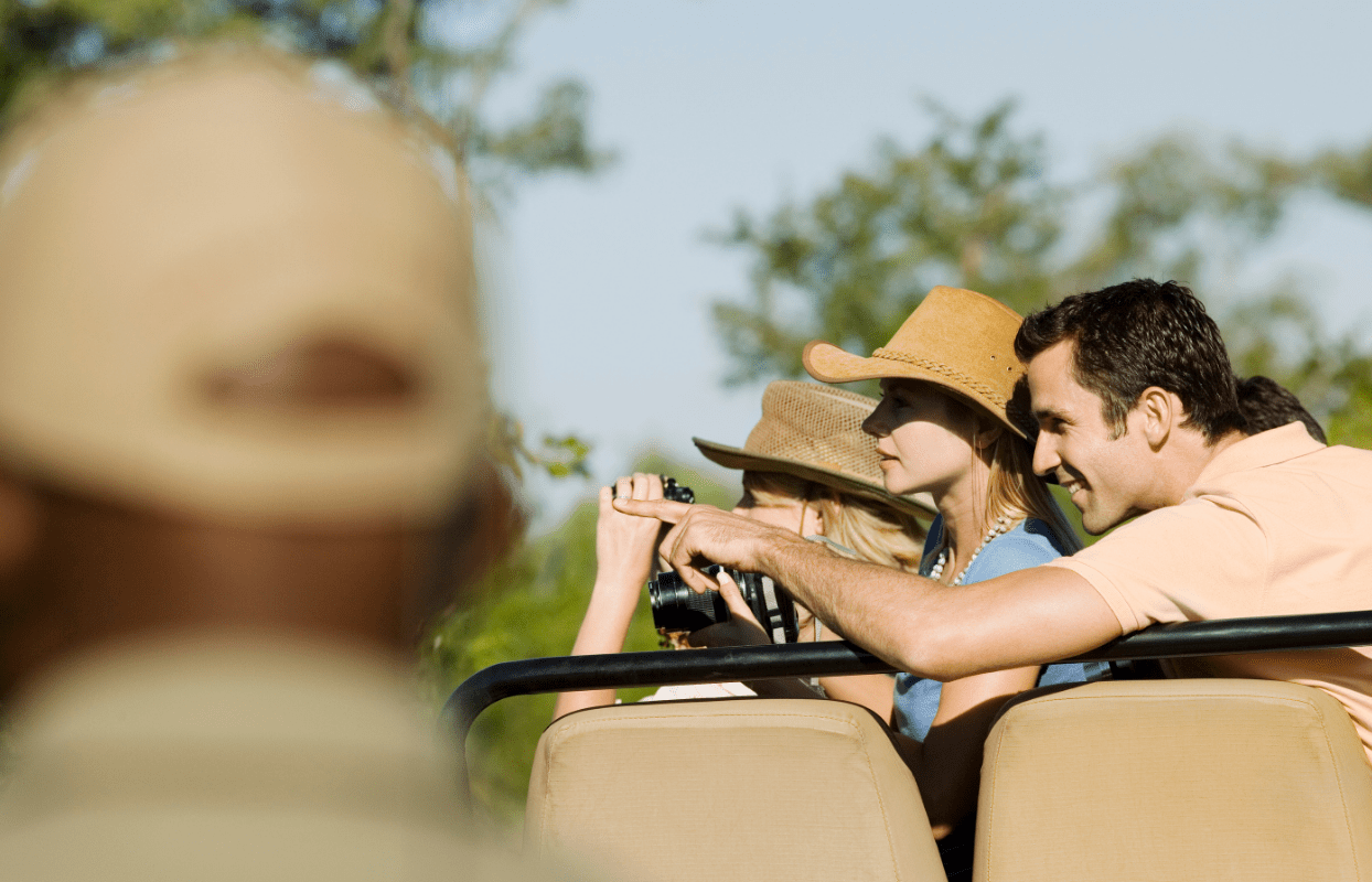 LECFS-IT1 - Tourists on Safari Drive Pointing in Wonder Sustainable Safaris Africa - Experiences - Romantic African Safari - Journeys - Luxury Eastern Cape Family Safari - Tourists on Safari Drive Pointing in Wonder